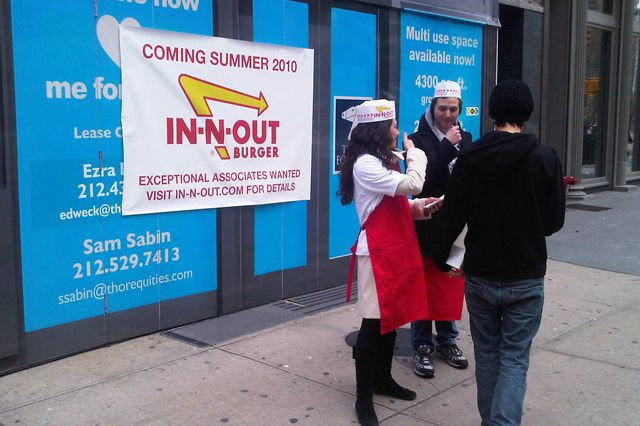 In-N-Out "workers" outside a "forthcoming" location at Broadway and 22nd Street.